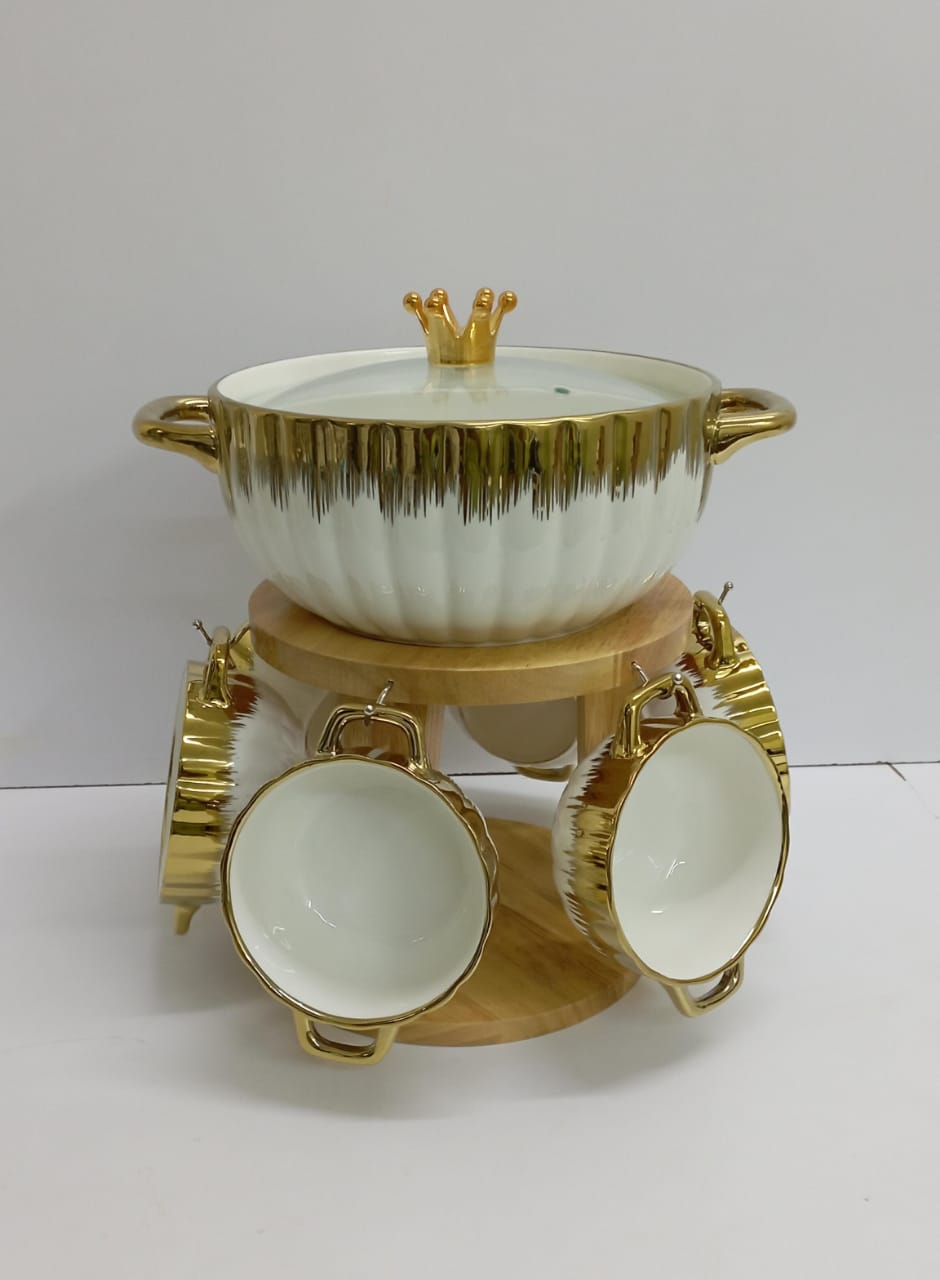 Seven pc ceramic soup set Color white with gold rim